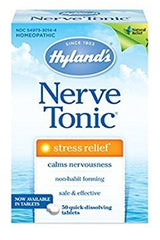 Hyland's Nerve Tonic quick-dissolve tablets bottle on a desk, for on-the-go stress relief.