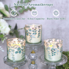 Immeiscent candle with eucalyptus leaf decal enhances decor