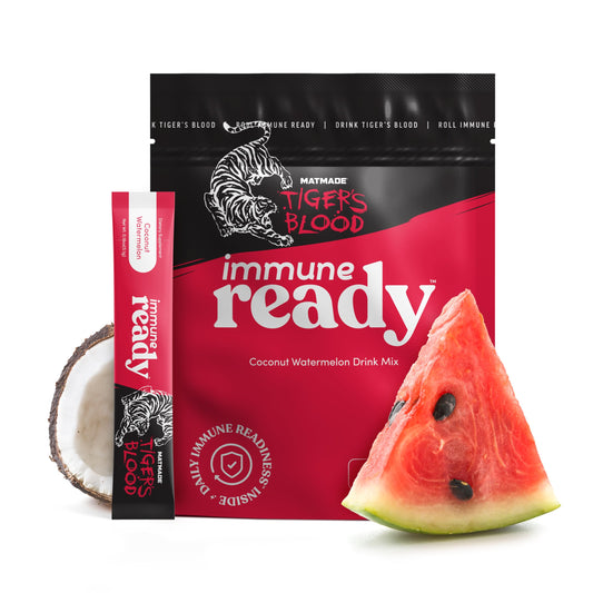 Immune Ready electrolytes packets pour into a glass for refreshing coconut-watermelon hydration.