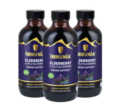 Immunia Elderberry & Wild Blueberry Concentrate bottle on a clean kitchen shelf, supporting daily immune health.