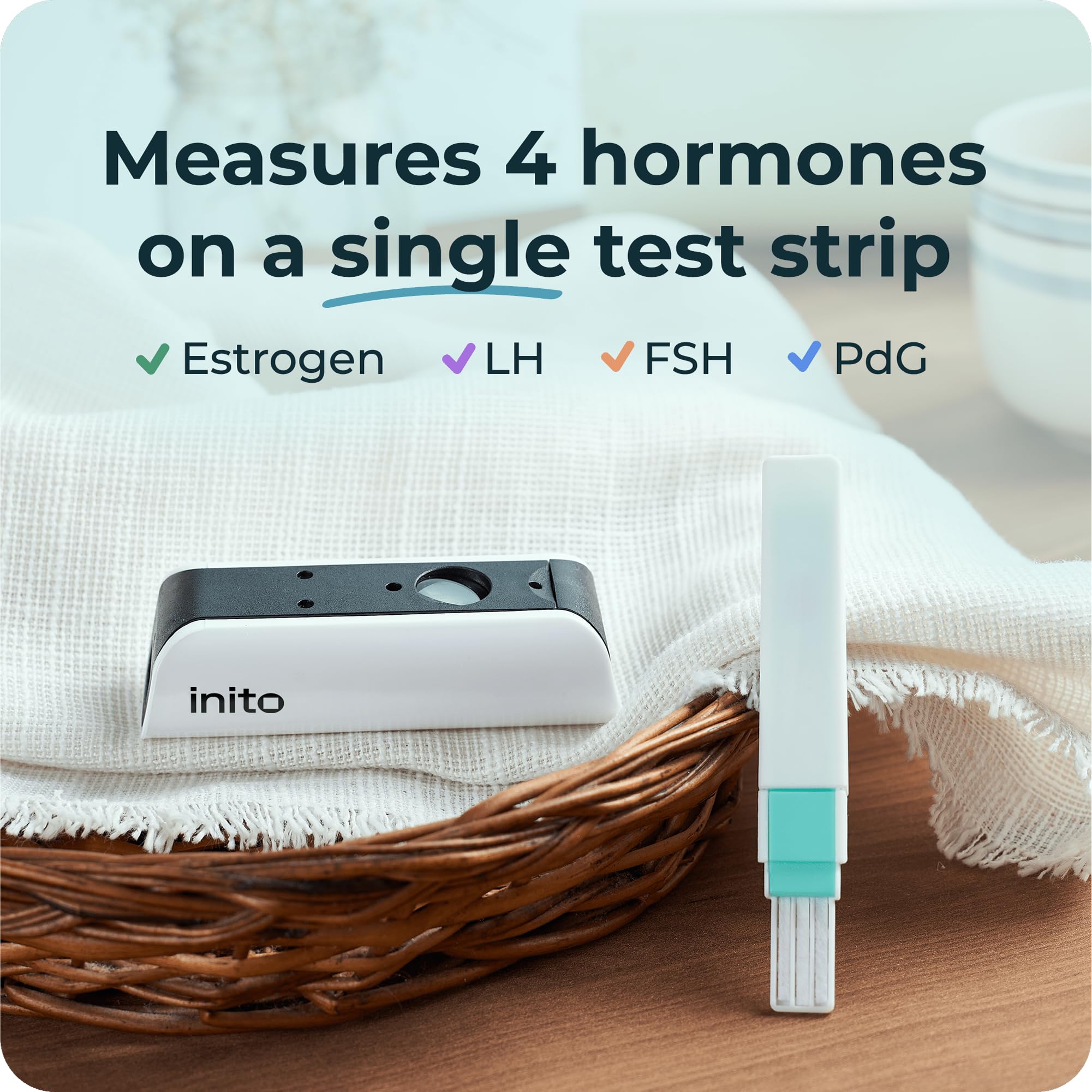 Inito test strip dipped in urine for 15 seconds.