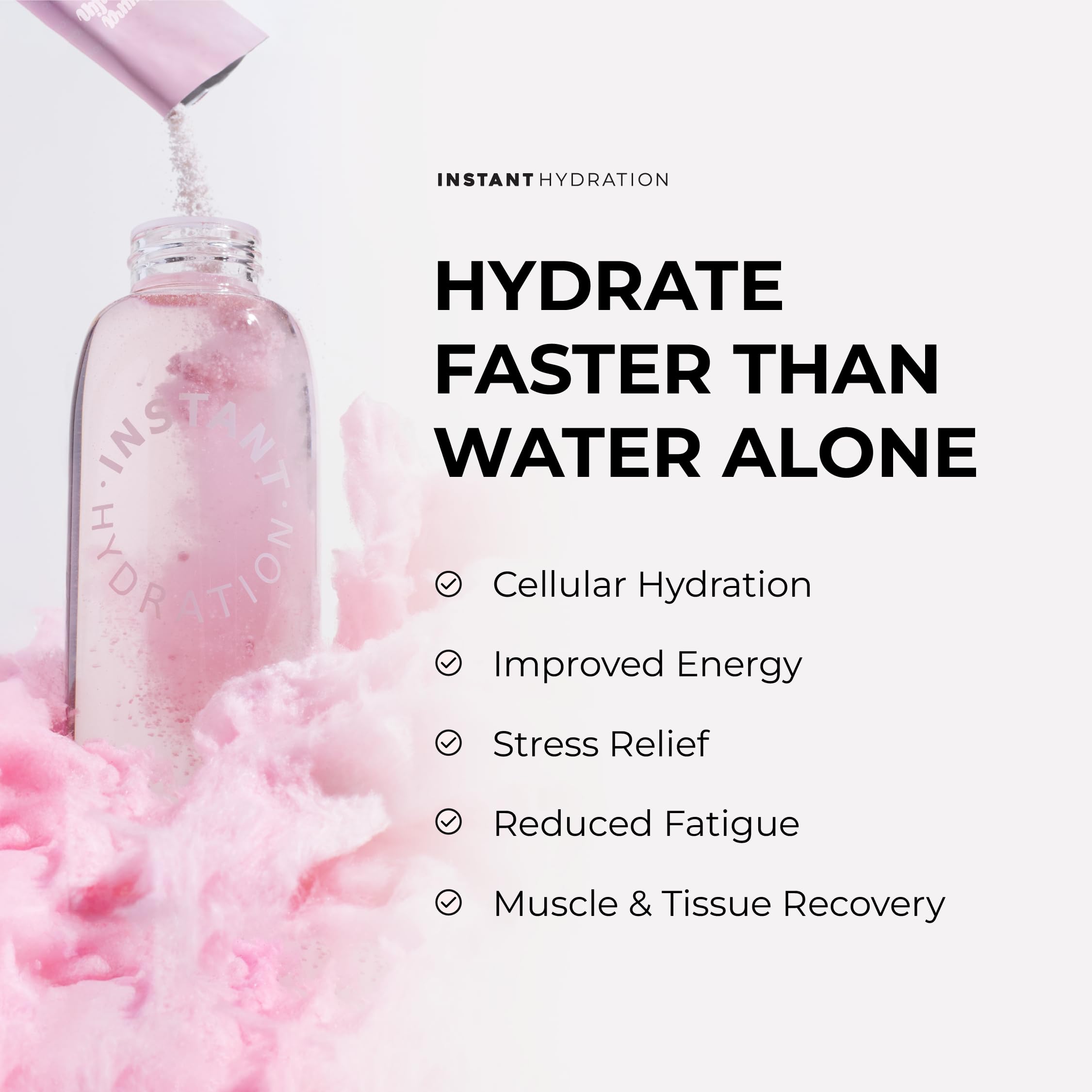 Instant Hydration glass with cotton candy powder being stirred for quick hydration