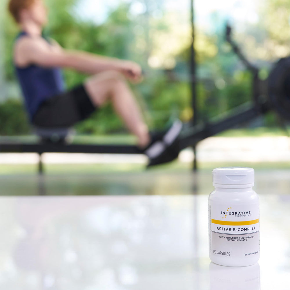 Integrative Therapeutics Active B-Complex capsules arranged on a clean desk for brain focus