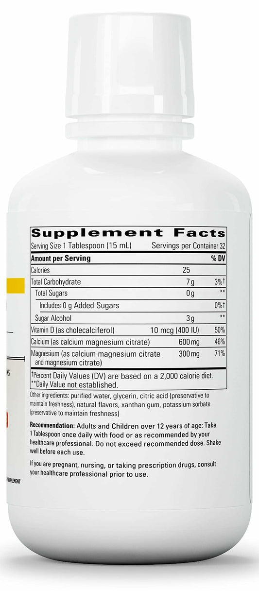 Close-up pouring Integrative Therapeutics liquid calcium magnesium to show texture.