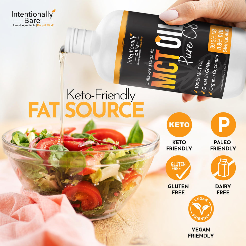 Intentionally Bare MCT oil clear liquid pouring from bottle.