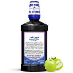 ioRinse concentrated irrigant bottle pour shows easy dosing for Waterpik users.