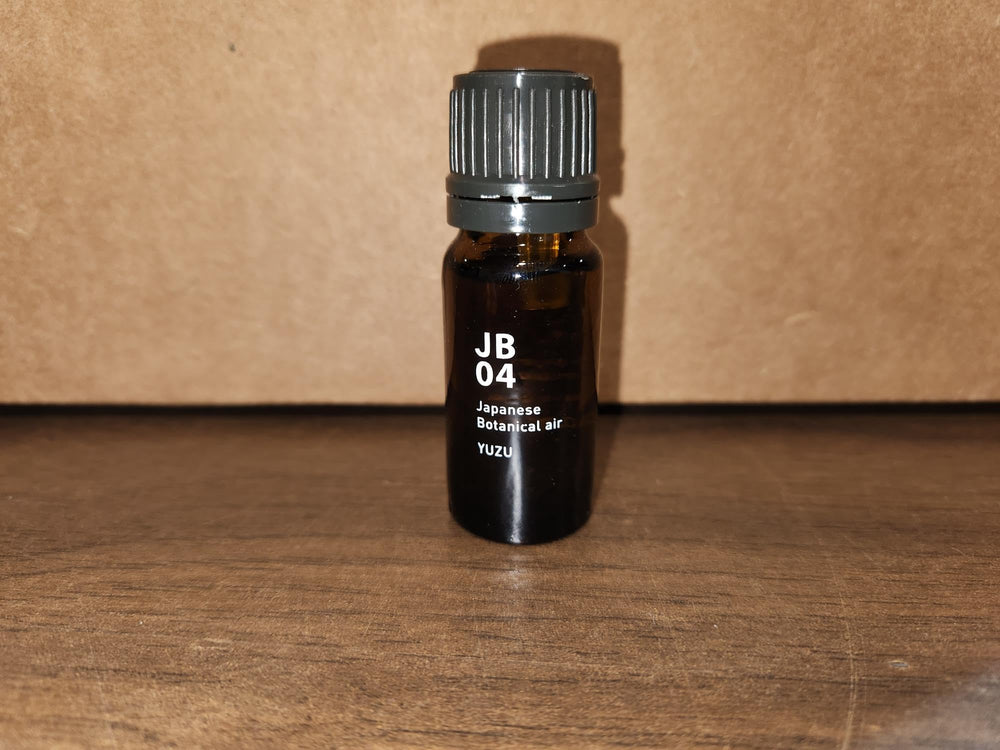 Yuzu essential oil drops in warm bath water for a spa-like moment.