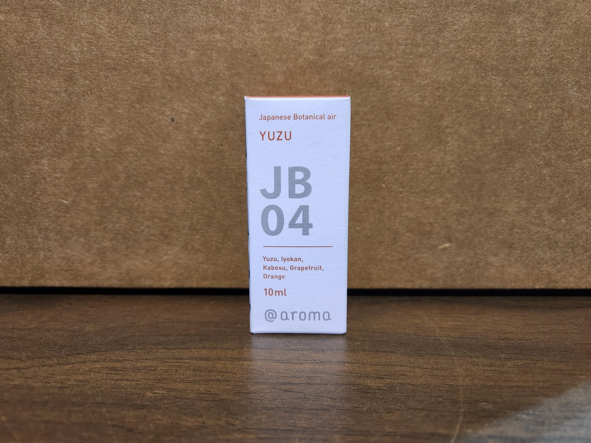 Close-up of IPPINKA Yuzu oil bottle label highlighting citrus notes.
