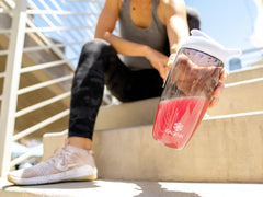 Isagenix AMPED BCAA Plus raspberry lemonade glass for refreshing intra-workout fuel.