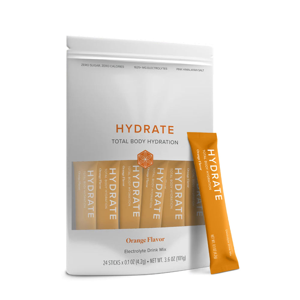 Isagenix Hydrate orange stick close-up ready to dissolve for quick electrolyte refreshment.