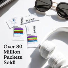 Isotonix Daily Essentials packet being poured into water for fast absorption.