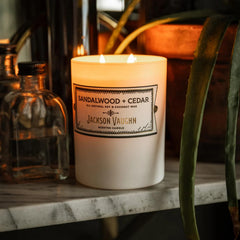 Jackson Vaughn Daily Rituals frosted glass jar candle in a minimalist room.