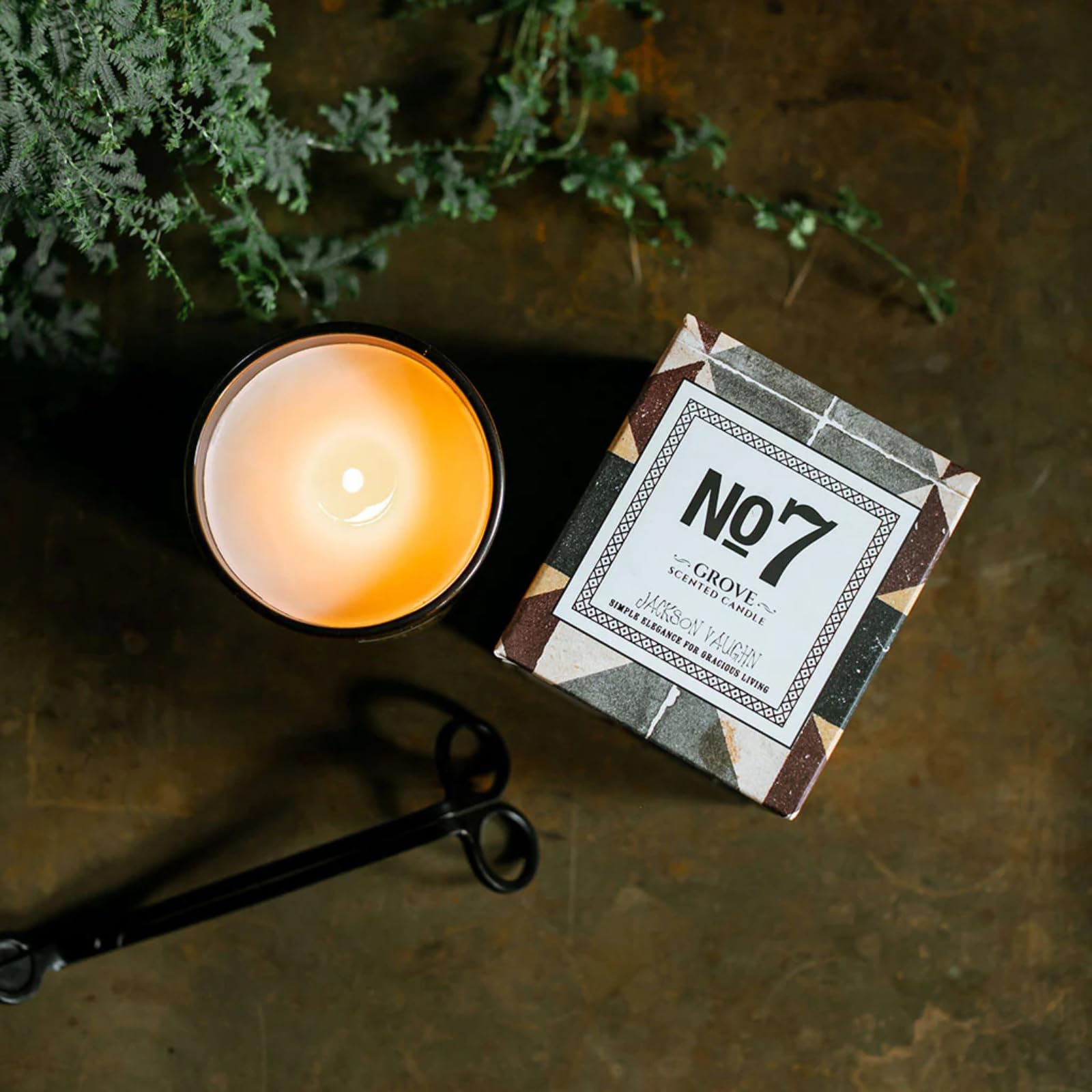 Jackson Vaughn No. 7 Grove candle glows softly for cozy rooms