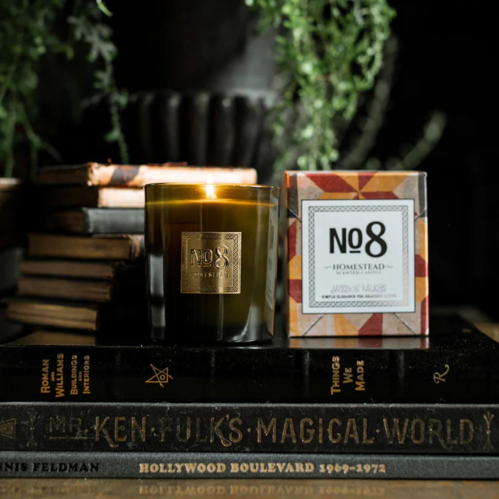 Jackson Vaughn No. 8 14-5oz candle on table demonstrates long-lasting fragrance for medium rooms.