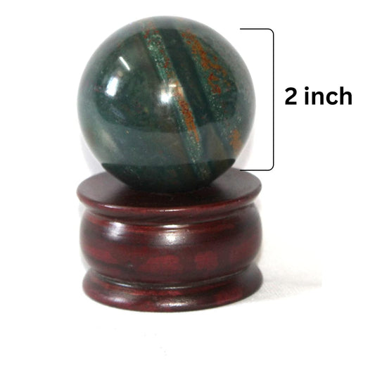 Jet International Bloodstone ball on desk enhances focus and grounding during daily rituals.