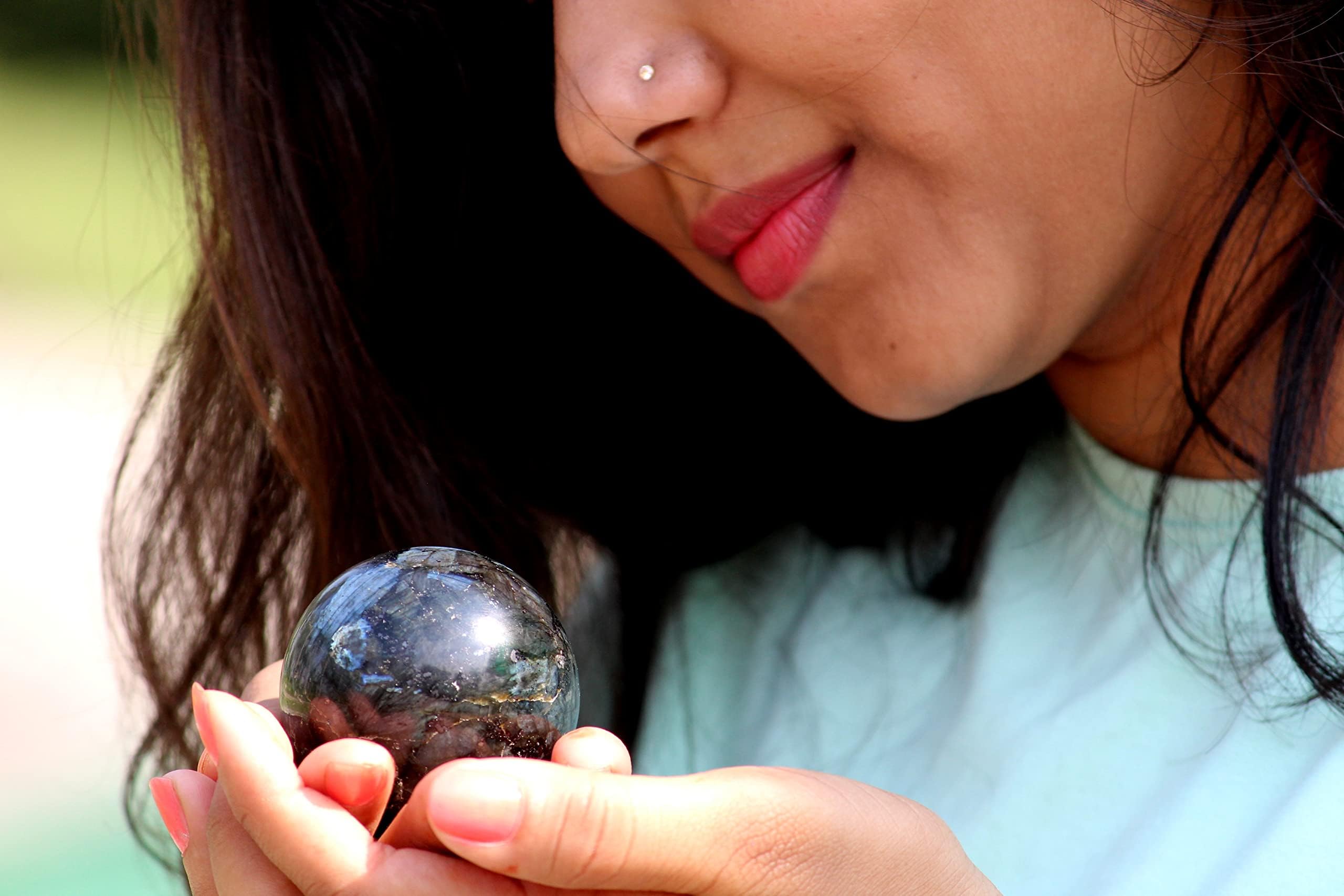 Jet International Larvikite ball used in Reiki practice for balance