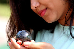 Jet International Larvikite ball used in Reiki practice for balance