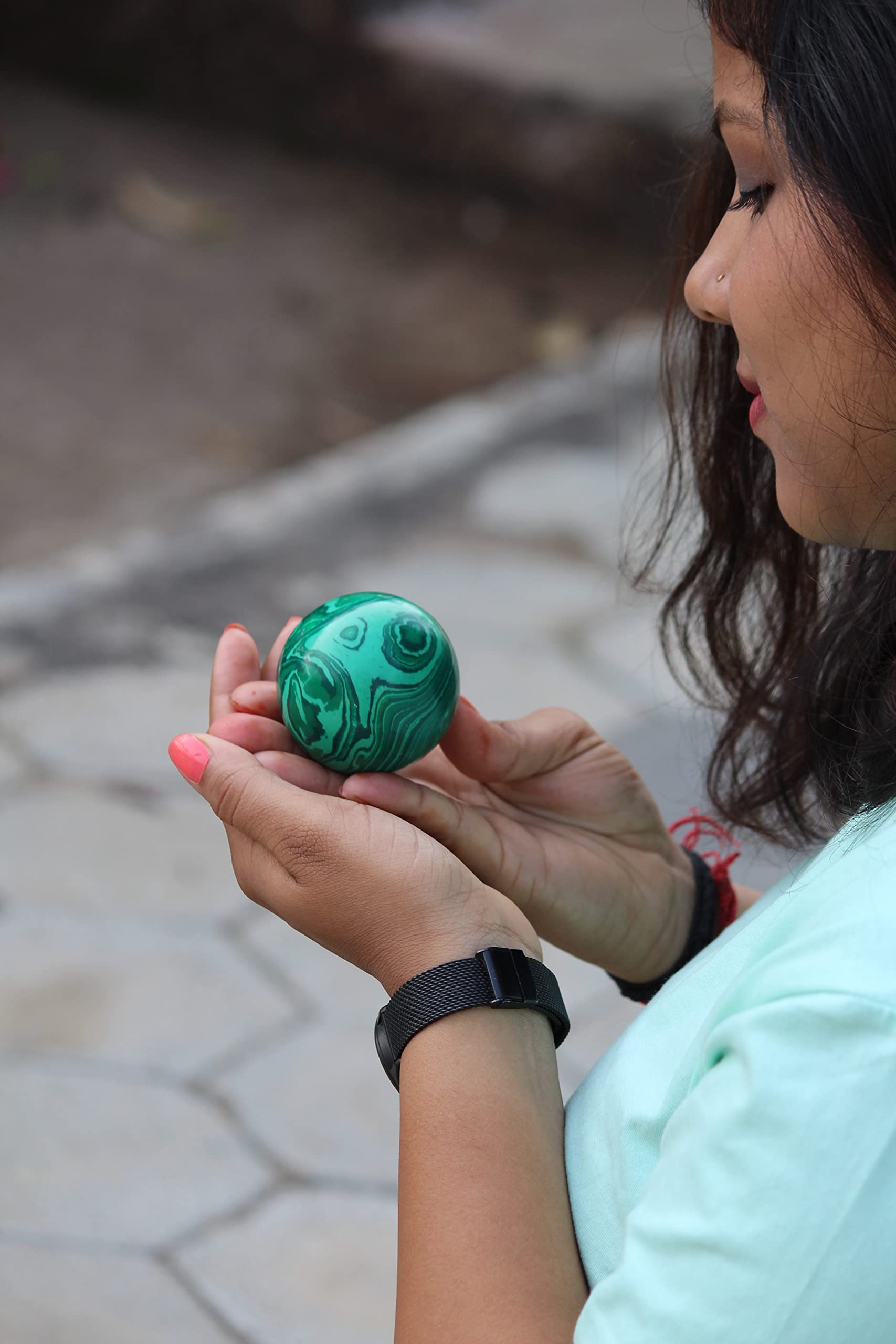 Jet International malachite sphere as a Reiki-friendly energy focus tool