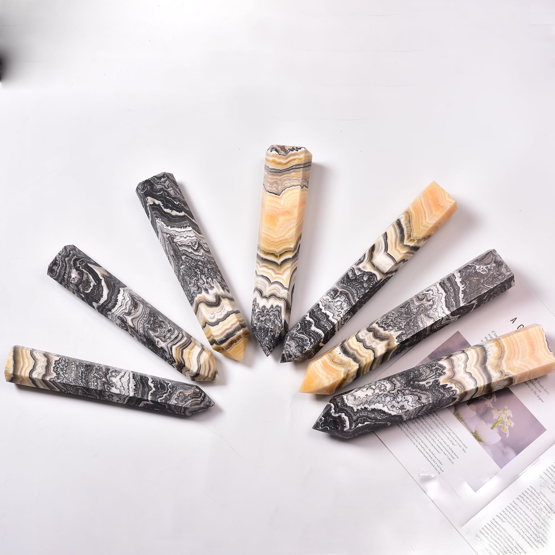 JIC Gem crystal wand close-up with hexagonal facets and warm tones