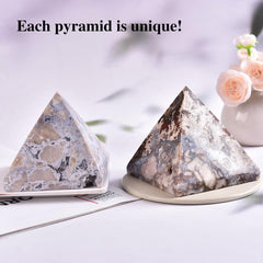 JIC Gem blue cherry blossom agate pyramid creates serene ambiance for yoga and reflection.