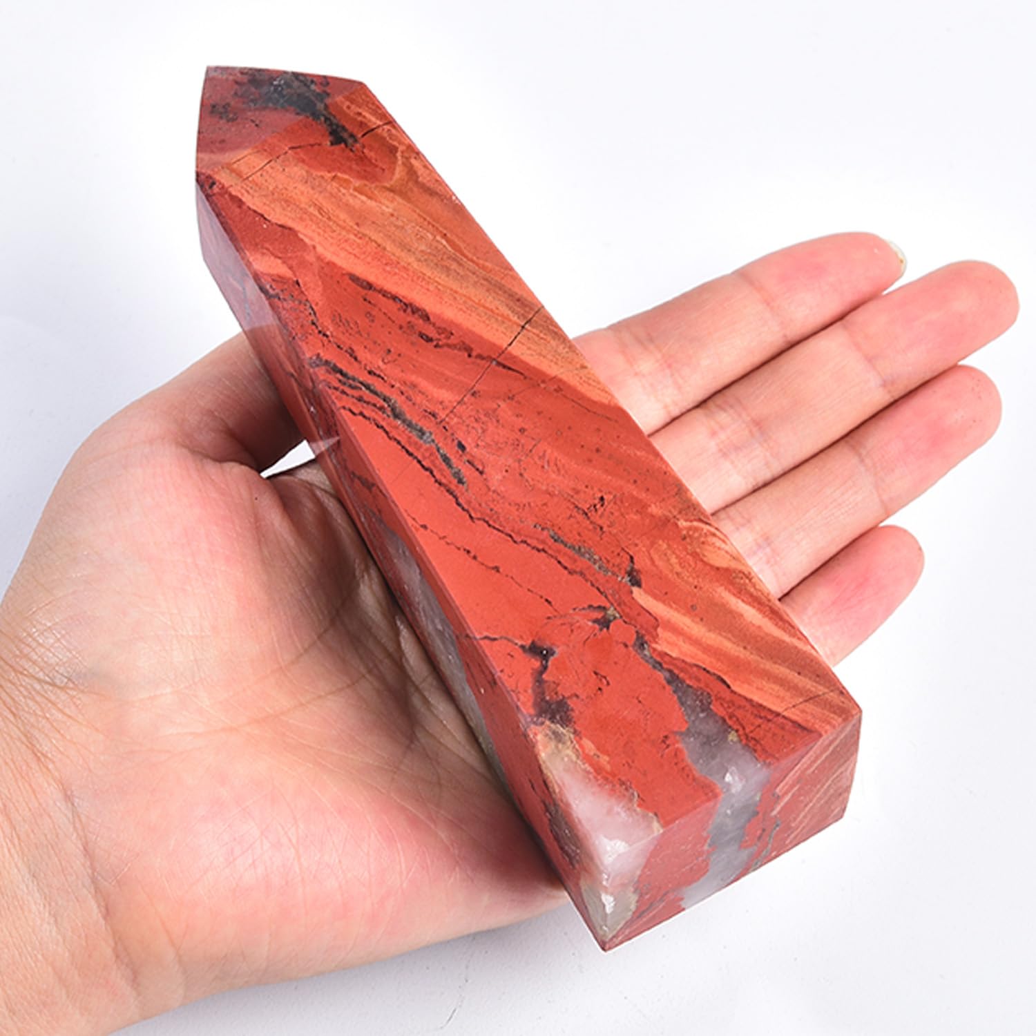 JIC Gem red jasper crystal tower side angle highlighting four facets and energy amplification
