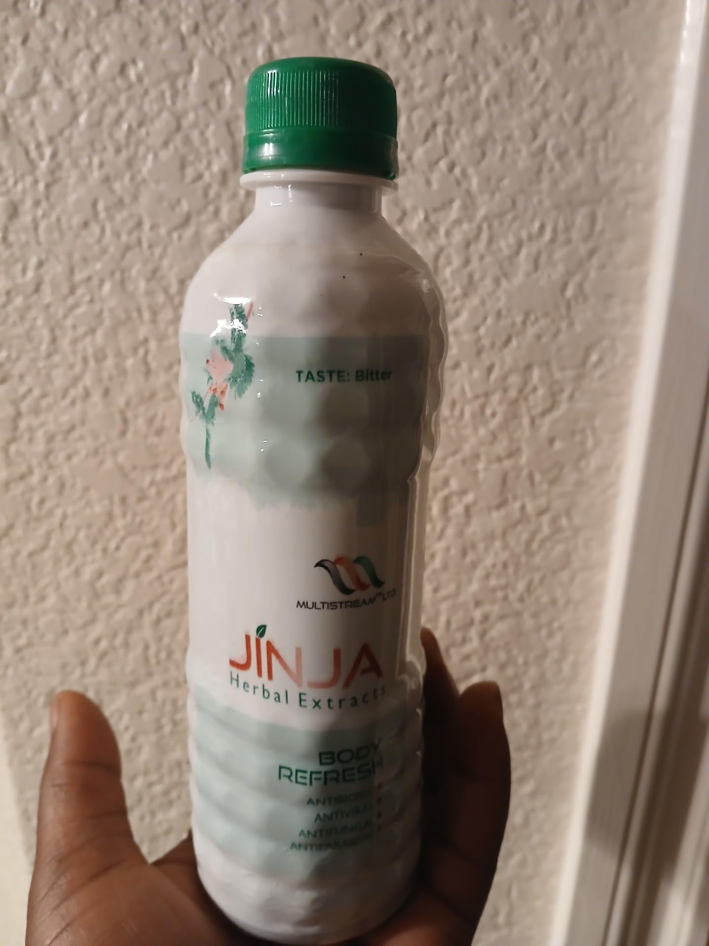 Jinja Herbal Extract bottle side view suggesting convenient 350ml serving