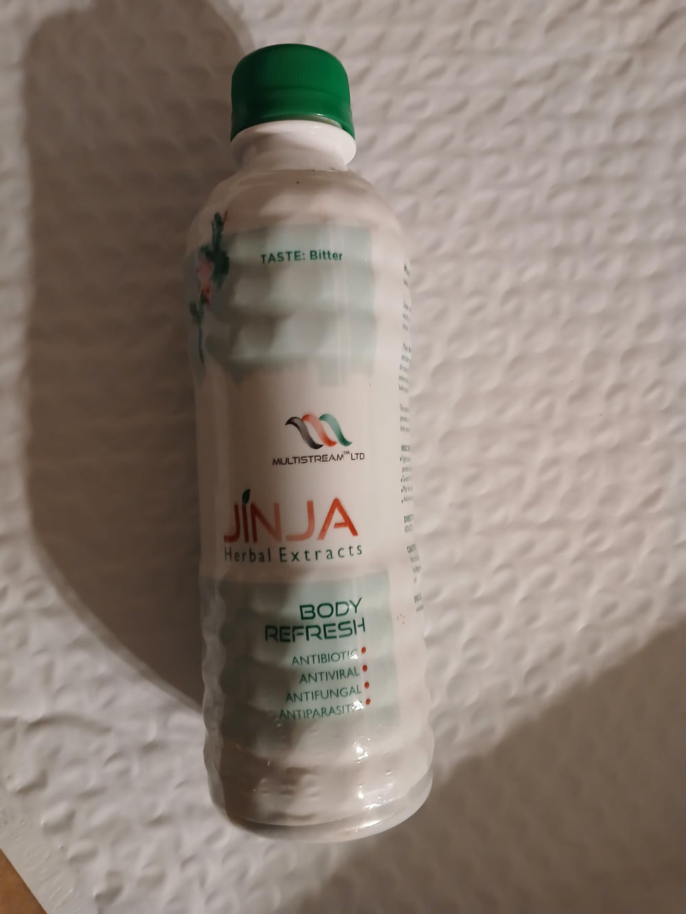 Jinja Herbal Extract poured into glass, ready to refresh