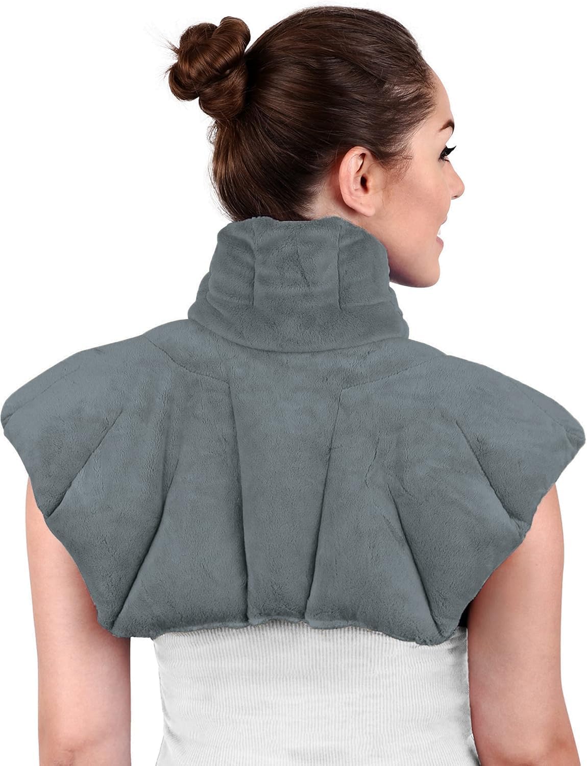 Joy & Grace microwavable heating pad on neck and shoulders providing cozy warmth