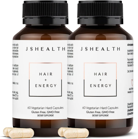 JSHealth Hair + Energy Formula bottle on the counter suggesting daily vitality.