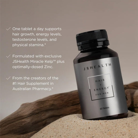 Close-up of JSHealth capsules emphasizes zinc and iodine for hair support.
