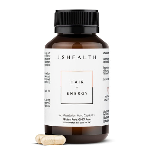 JSHealth Hair Formula bottle close-up showing capsules for nourishing hair growth support.