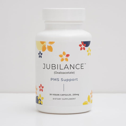Close-up of Jubilance oxaloacetate capsule showing smooth coating.
