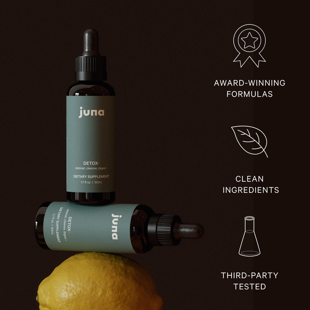 Glass of water with Juna Chlorophyll Drops and minty lemon flavor.