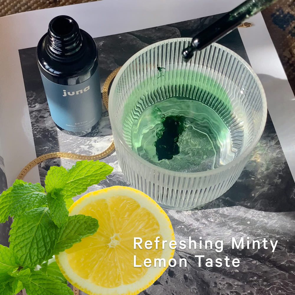 Juna Chlorophyll Drops in a water glass for spa-like hydration
