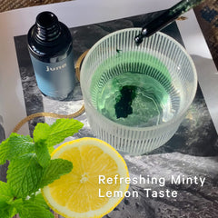 Juna Chlorophyll Drops in a water glass for spa-like hydration