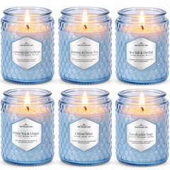 JXDLSQ Lake Blue Candles six-pack displayed on decorative glass for inviting home ambience