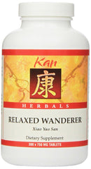 Kan Herb Relaxed Wanderer bottle pouring, a soothing herbal supplement for daily balance.