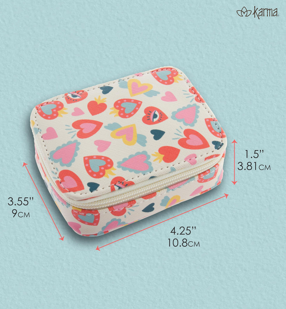 Karma travel pill case close-up highlighting the gold zipper pull for secure opening.