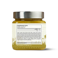 Pouring Kerala Ayurveda Kalyanaka Ghritham for daily mood balance.