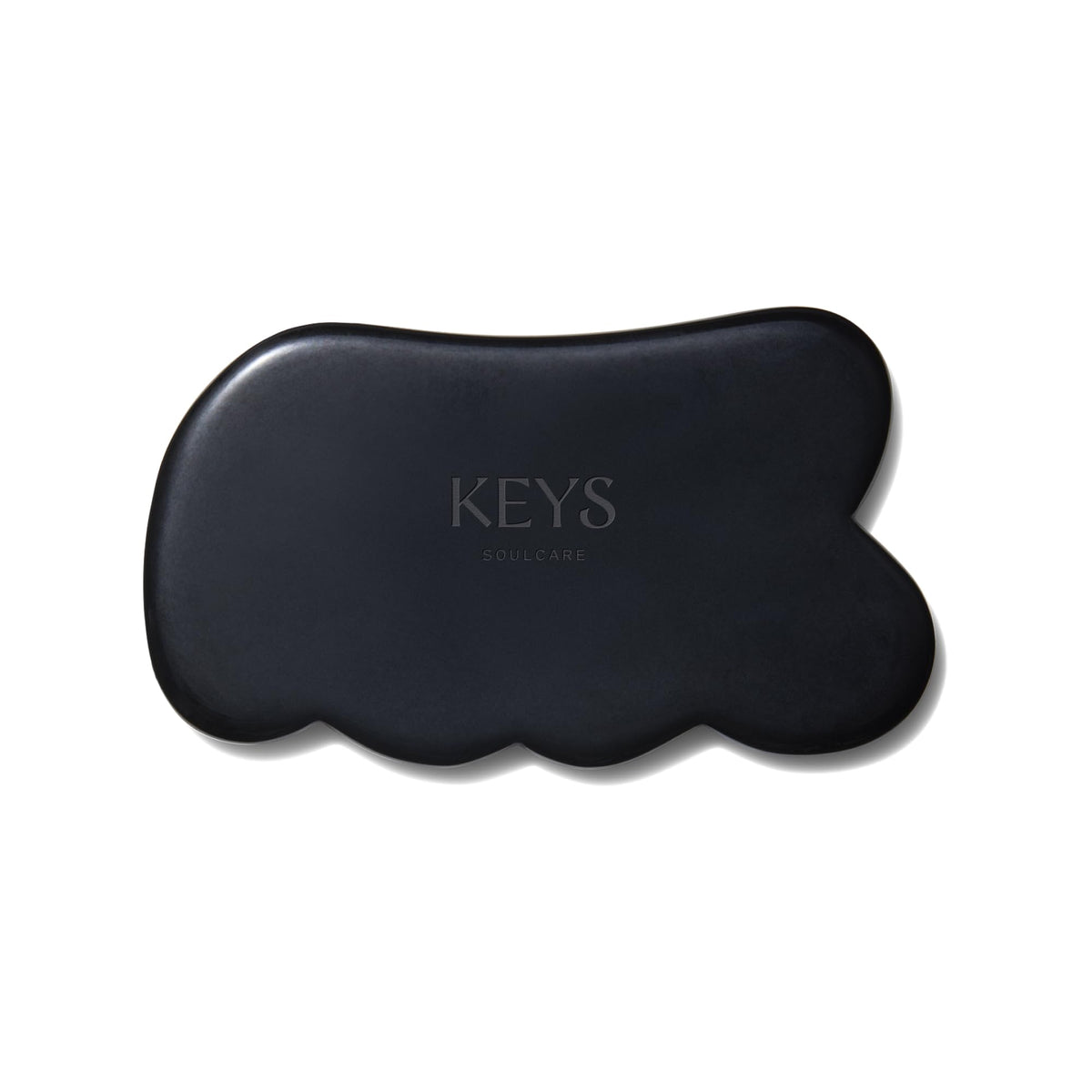 Keys Soulcare Obsidian Stone Gua Sha Tool front view for relaxing facial and body massage.