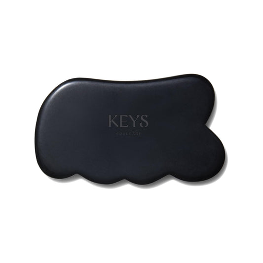 Keys Soulcare Obsidian Stone Gua Sha Tool front view for relaxing facial and body massage.