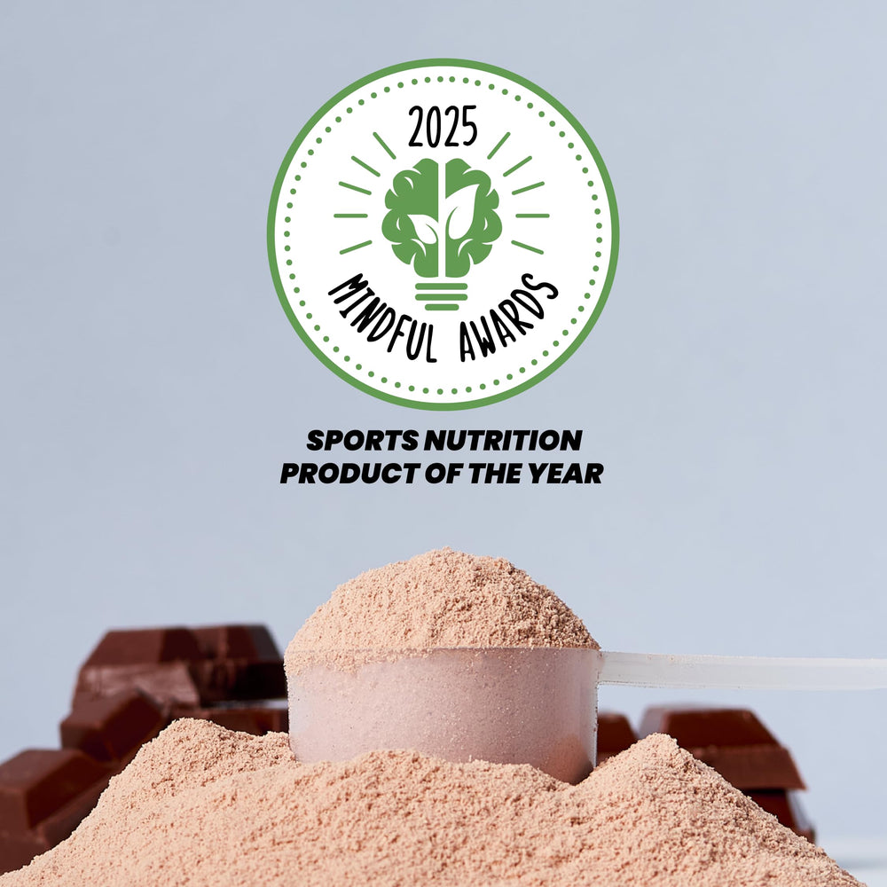 Shake of Kick Whey Protein Chocolate poured into a glass with ice.