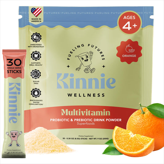 Kinnie Kids multivitamin stick orange flavor dissolving in water for a quick nutrient boost