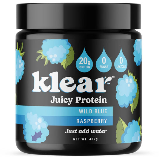 Klear clear protein powder poured into a glass for a refreshing blue raspberry drink