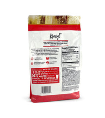 Scoop of Konsyl Daily Psyllium powder stirred into water for easy daily use