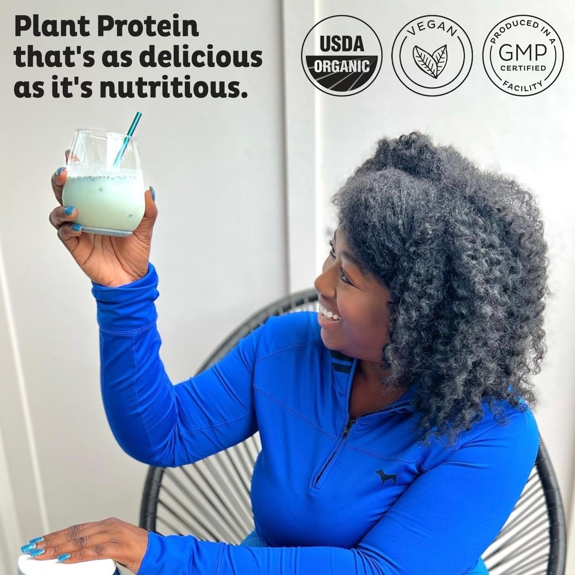 KOS protein powder scoop in glass shake illustrating convenient, quick nutrition.