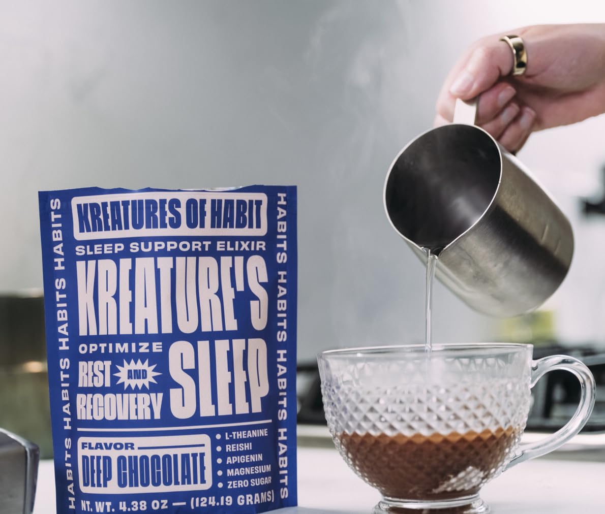 Kreatures of Habit Sleep chocolate cup on nightstand.