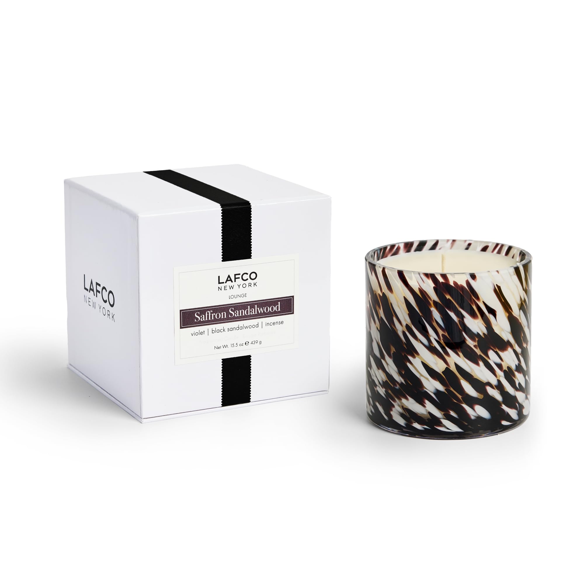 LAFCO New York Signature Fall Candle in saffron sandalwood enhances cozy studio ambience.