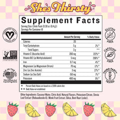 Pouring She’s Thirsty Strawberry Lemonade powder into water to boost hydration with coconut electrolytes