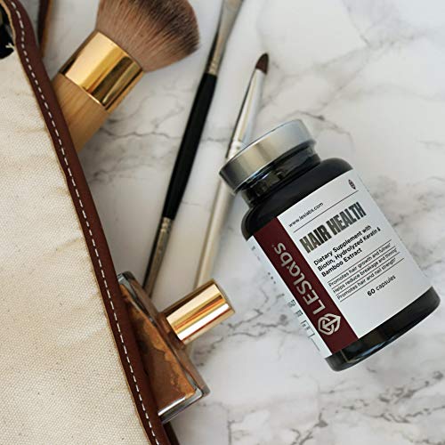 Product shown in use, suggesting a daily routine for hair and nail vitality.